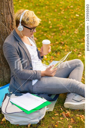 smiling male student in eyeglasses with tablet pc smiling male student in eyeglasses with tablet pc 10998660