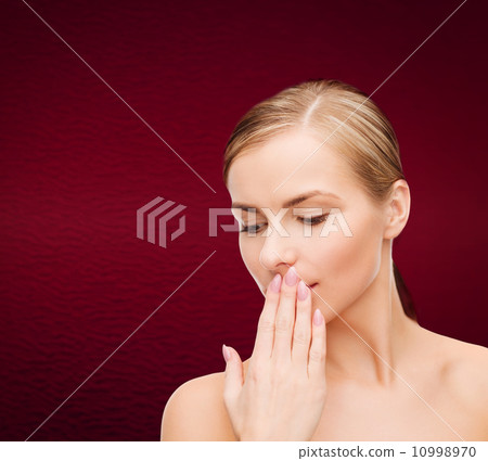 young woman doing hush gesrute 10998970