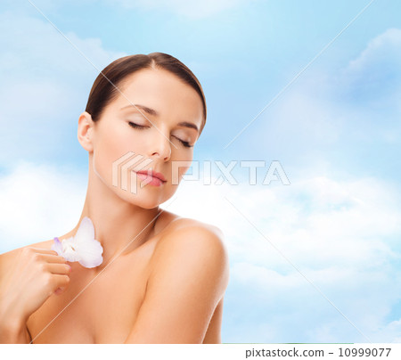 relaxed woman with orhid flower 10999077
