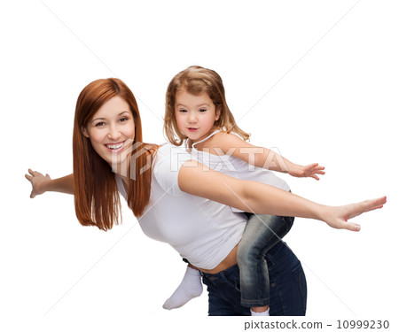 happy mother and child doing piggy back happy mother and child doing piggy back 10999230
