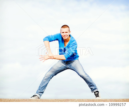 handsome boy making dance move 10999257