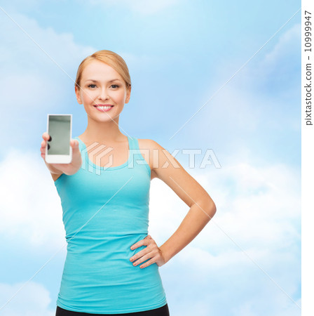sporty woman with smartphone 10999947
