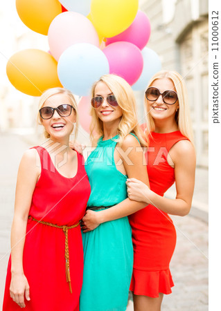 beautiful girls with colorful balloons in the city 11000612