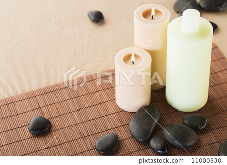 shampoo bottle, massage stones and candles shampoo bottle, massage stones and candles 11000830