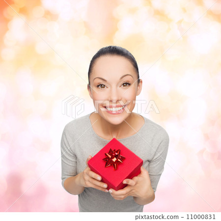 smiling asian woman with red gift box smiling asian woman with red gift box 11000831