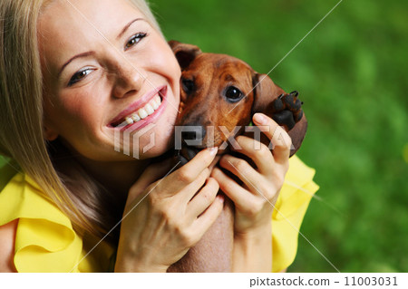 woman dachshund in her arms woman dachshund in her arms 11003031