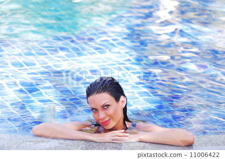Woman in swimming pool Woman in swimming pool 11006422