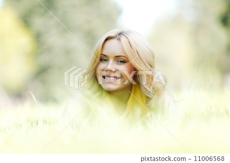 Woman lying on grass Woman lying on grass 11006568