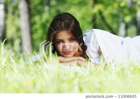 Woman sleeping on grass Woman sleeping on grass 11006605