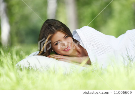 Woman sleeping on grass Woman sleeping on grass 11006609