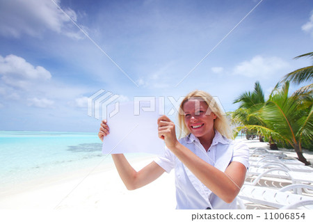 business woman with blank paper on the ocean coast business woman with blank paper on the ocean coast 11006854