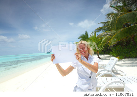 business woman with blank paper on the ocean coast business woman with blank paper on the ocean coast 11007051
