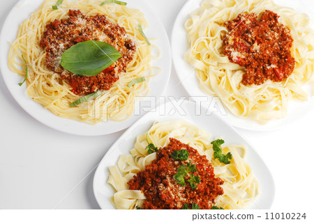 Plates with spaghetti bolognese Plates with spaghetti bolognese 11010224