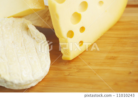 cheese on a wooden table cheese on a wooden table 11010243