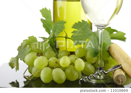 bottle with white wine and glass and grapes 11010669