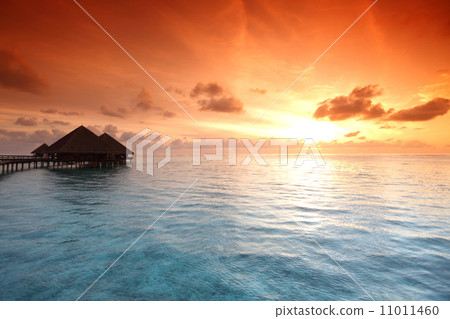 maldivian houses on sunrise 11011460