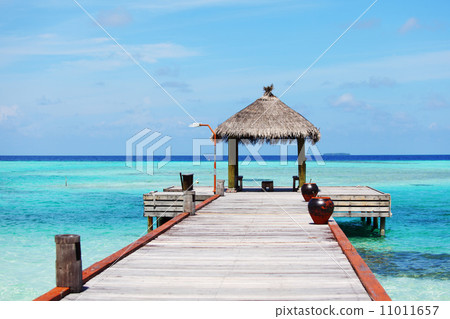 resort maldivian houses in blue sea 11011657