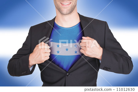 Businessman opening suit to reveal shirt with flag Businessman opening suit to reveal shirt with flag 11012630