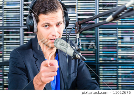 Male radio presenter in radio station on air 11012676