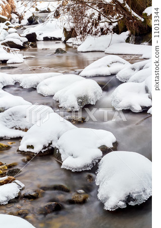 Falls on the small mountain river in a wood shooted in winter Falls on the small mountain river in a wood shooted in winter 11013344
