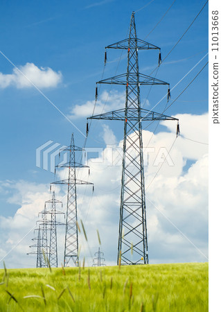 high voltage power lines against a blue sky 11013668