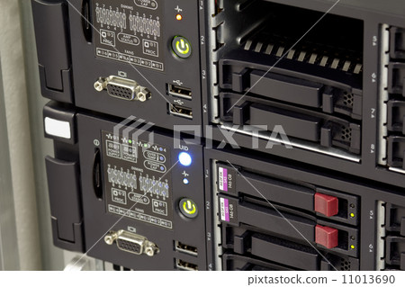 servers stack with hard drives in a datacenter 11013690