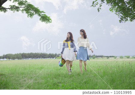 A woman walking on the lawn A woman walking on the lawn 11013995