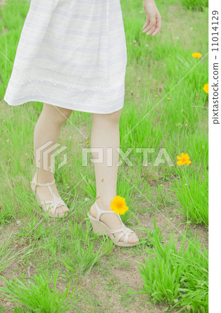 Women with white dress and sandals Women with white dress and sandals 11014129