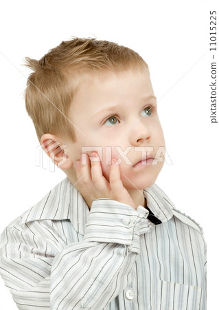 Studio portrait of young pensive beautiful boy 11015225