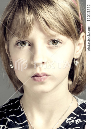 Studio portrait of young beautiful girl 11015232