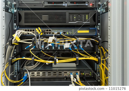 Stock Photo: fiber optic datacenter with media converters and optical cables