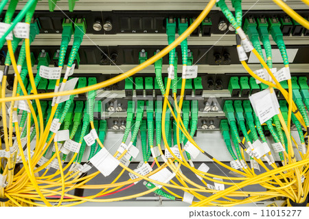 Stock Photo: fiber optic datacenter with media converters and optical cables