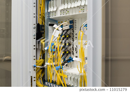 Stock Photo: fiber optic datacenter with media converters and optical cables