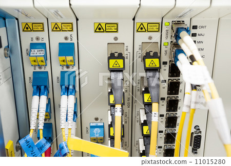 Stock Photo: fiber optic datacenter with media converters and optical cables