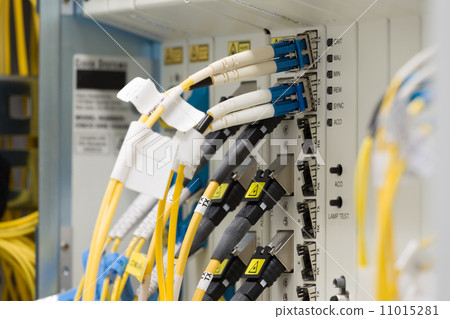 Stock Photo: fiber optic datacenter with media converters and optical cables