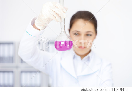 Young chemical female researcher working with chemicals 11019431