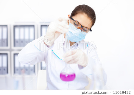Young chemical female researcher working with chemicals in labor 11019432