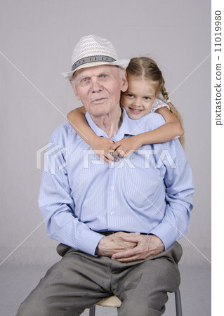Portrait of an old man eighty years with granddaughter Portrait of an old man eighty years with granddaughter 11019980