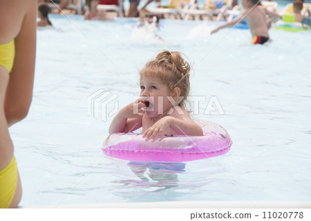 Frozen girl standing with a circle in the pool Frozen girl standing with a circle in the pool 11020778