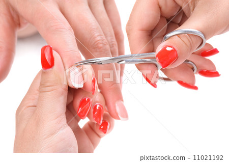 manicure applying - cutting the cuticle  11021192