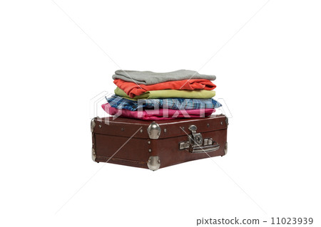 stack of clothes on suitcase isolated on white background 11023939