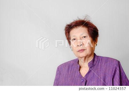 Portrait of Asian elderly woman, isolated gray background. Portrait of Asian elderly woman, isolated gray background. 11024357
