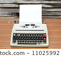 typewriter with blank paper and wood background 11025992