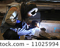 Industrial worker welding in factory 11025994