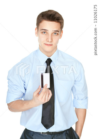 Young man holding a credit card isolated on white Young man holding a credit card isolated on white 11026175