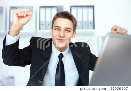 Young businessman celebrating his success Young businessman celebrating his success 11026307