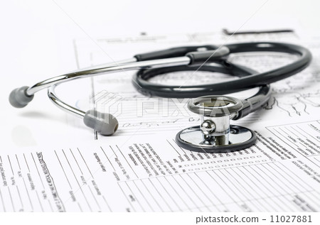 stethoscope resting on a sheet of medical lab test results stethoscope resting on a sheet of medical lab test results 11027881