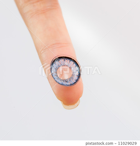cosmetic contact lenses  hand 11029029