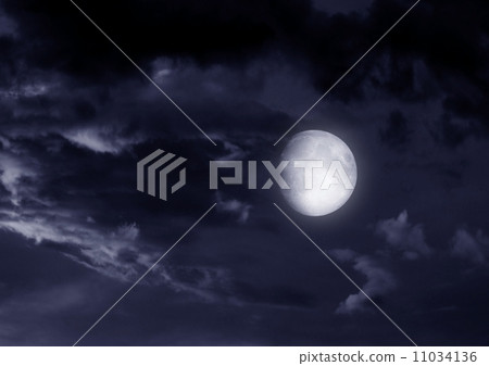 The moon in the night sky in clouds 11034136