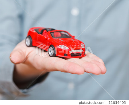 new red car on palm new red car on palm 11034403